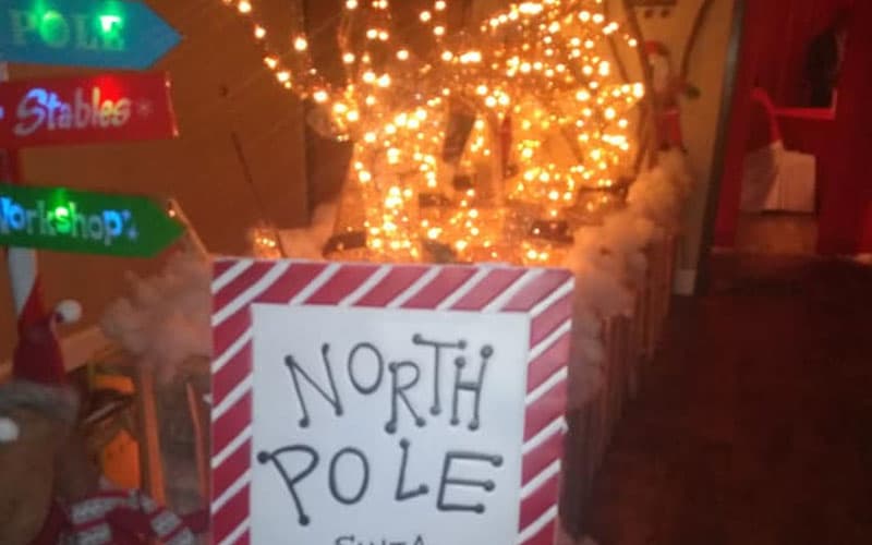 sign of the north pole with light in the background