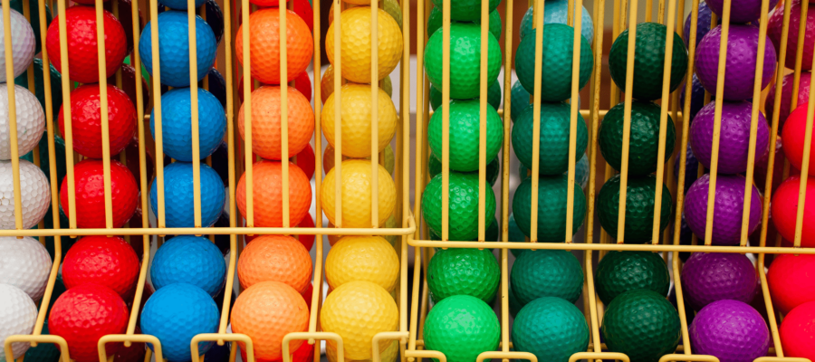 Lots of color golf balls in rack