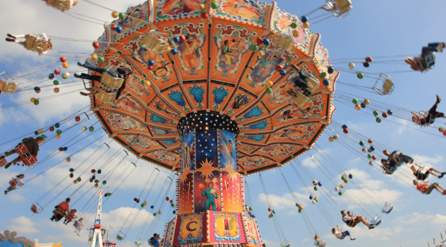 People spinning on a festival swing ride