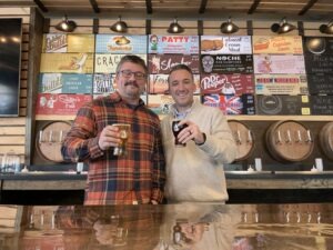 Two Men Holding Beer